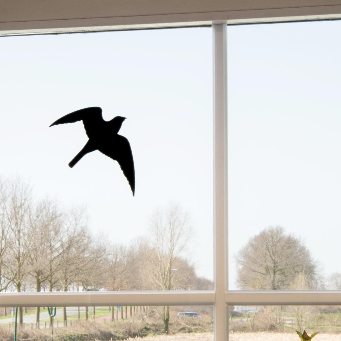 Raamsticker in de vorm van een vogel